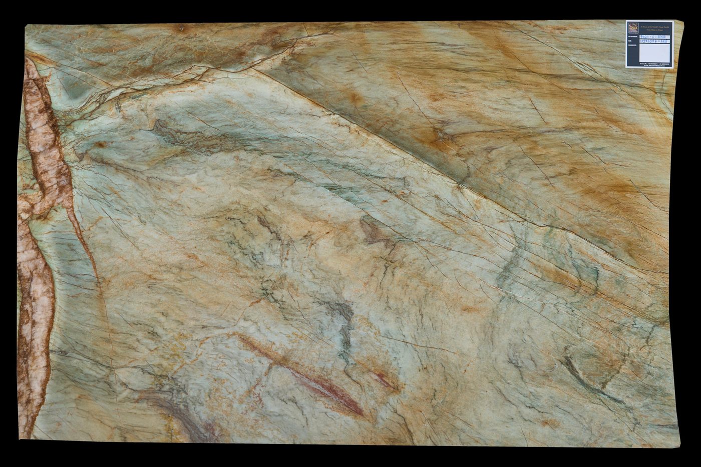 Green and gold onyx slab with pink veining